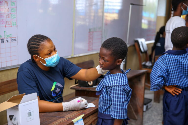 medical personnel checking a pupil